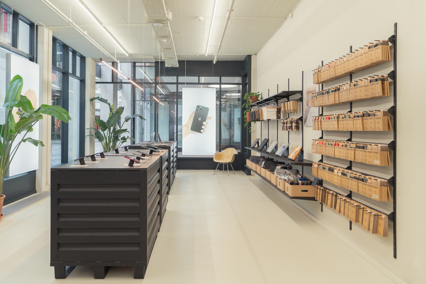 Phones and accessories displayed in a bright, modern electronics store.